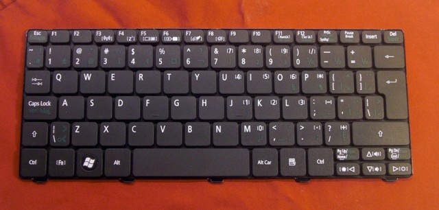 The original keyboard with it's annoying multi-lingual layout.