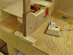 Pine blocks ensure that the bulkheads won't move from the clamping pressure.